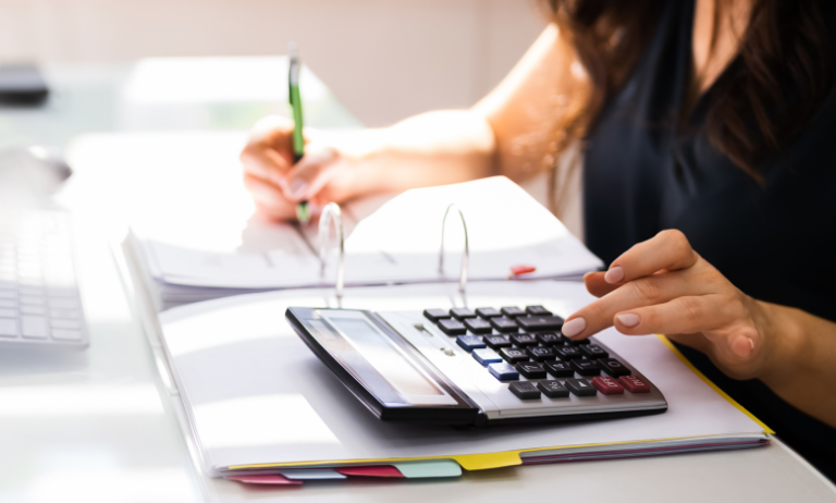 Women with calculator doing her business accounts